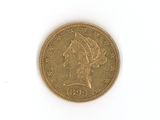 l'image d'une pièce d'or sur laquelle figure une tête de femme