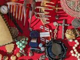 many different items in a case on a red surface