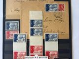 an image of a collection of stamps and envelopes on a table
