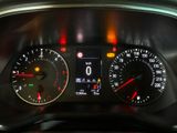 a close up of a car dashboard with various gauges and numbers