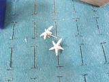 two small airplanes that are sitting on a blue rug
