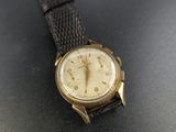 a close up of a wrist watch on a table