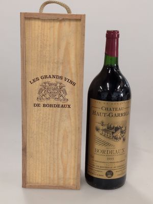 an image of a bottle of red wine next to a wooden box