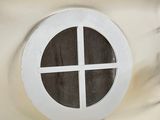 a picture of a small window in the wall of a bathroom
