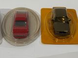 three toy cars that are sitting on top of each other