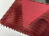 a picture of a red and green object on a table