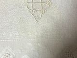 a close up of a white cloth with a cross on it