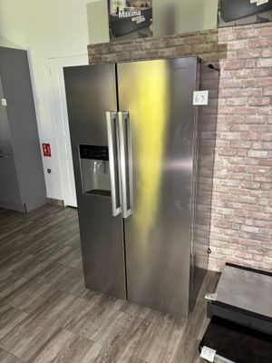 an image of a stainless steel refrigerator in a kitchen