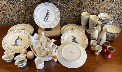 a table with many different types of china on it