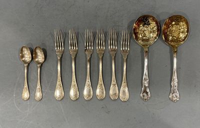 a lot of silver spoons and forks on the table