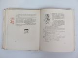 an open book with a drawing of a man riding a horse