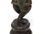 bronze statue of a man holding an elephant on a pedestal