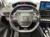 the interior of a car with a steering wheel and dashboard controls