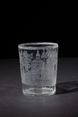 a glass with a picture of a castle on it