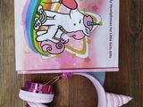 a close up of a hello kitty headphone with a box on a table