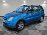 a picture of a blue suv parked in a garage