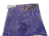 purple t - shirt in a plastic bag on a white background