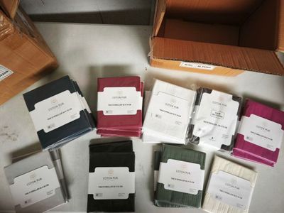 several pairs of socks are laid out on a table in a box