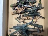 a box with a bunch of military toys inside of it