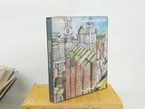 several books are stacked on top of each other on a table