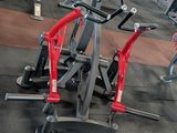 a gym with a lot of machines in the room