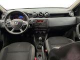 the interior of a small car with a steering wheel and dashboard controls