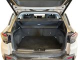 the back of a car with the trunk open and the seats down