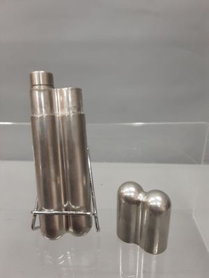 two metal objects on display in a glass case