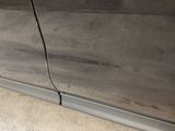 a close up of a car door with the door handle missing