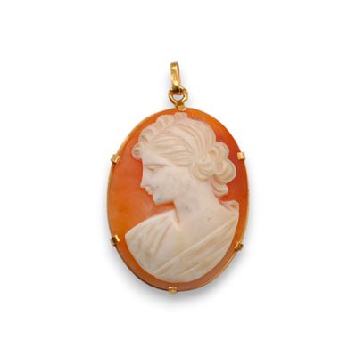 an antique carved cameo of a woman in profile
