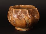 an image of a brown vase on a black background
