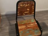 a chair that is sitting in the corner of a room