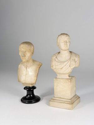 two marble busts of men and a bust of a woman