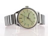 a watch that is sitting on a white surface