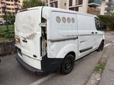 a white van that has been vandalized and is parked in a parking lot