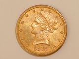 an image of a gold coin with a woman ' s head on it