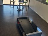 hardwood flooring in an office with a tread tread in the middle of the room