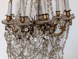 a chandelier hanging from the ceiling with many lights