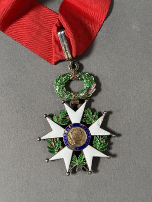 an image of a medal with a ribbon around it on a table