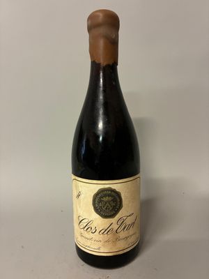 the bottle of wine is empty on the table