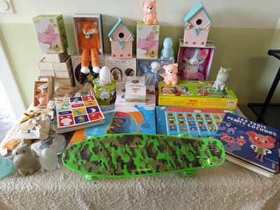 a pile of toys and books on a table