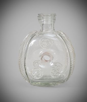 a clear glass bottle with a ring inside of it