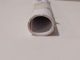 a roll of toilet paper on the floor next to a roll of toilet paper
