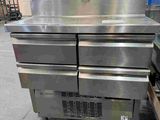 several stainless steel ovens stacked on top of each other in a warehouse