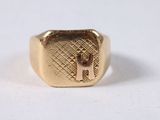 an image of a gold signet ring with the letter j on it