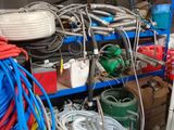 a bunch of wires and hoses on a shelf