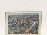 an aerial view of a city with a plane flying over it