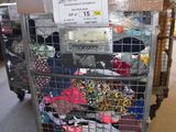 a cart with many items in it in a warehouse