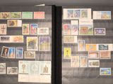 many different stamps on the pages of a book