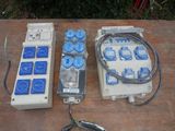 three remote controls and a control board on a table